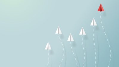 Paper airplanes flying on blue sky with form of growing graph