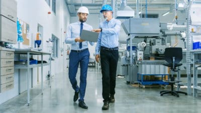 Engineers walk through a facility.