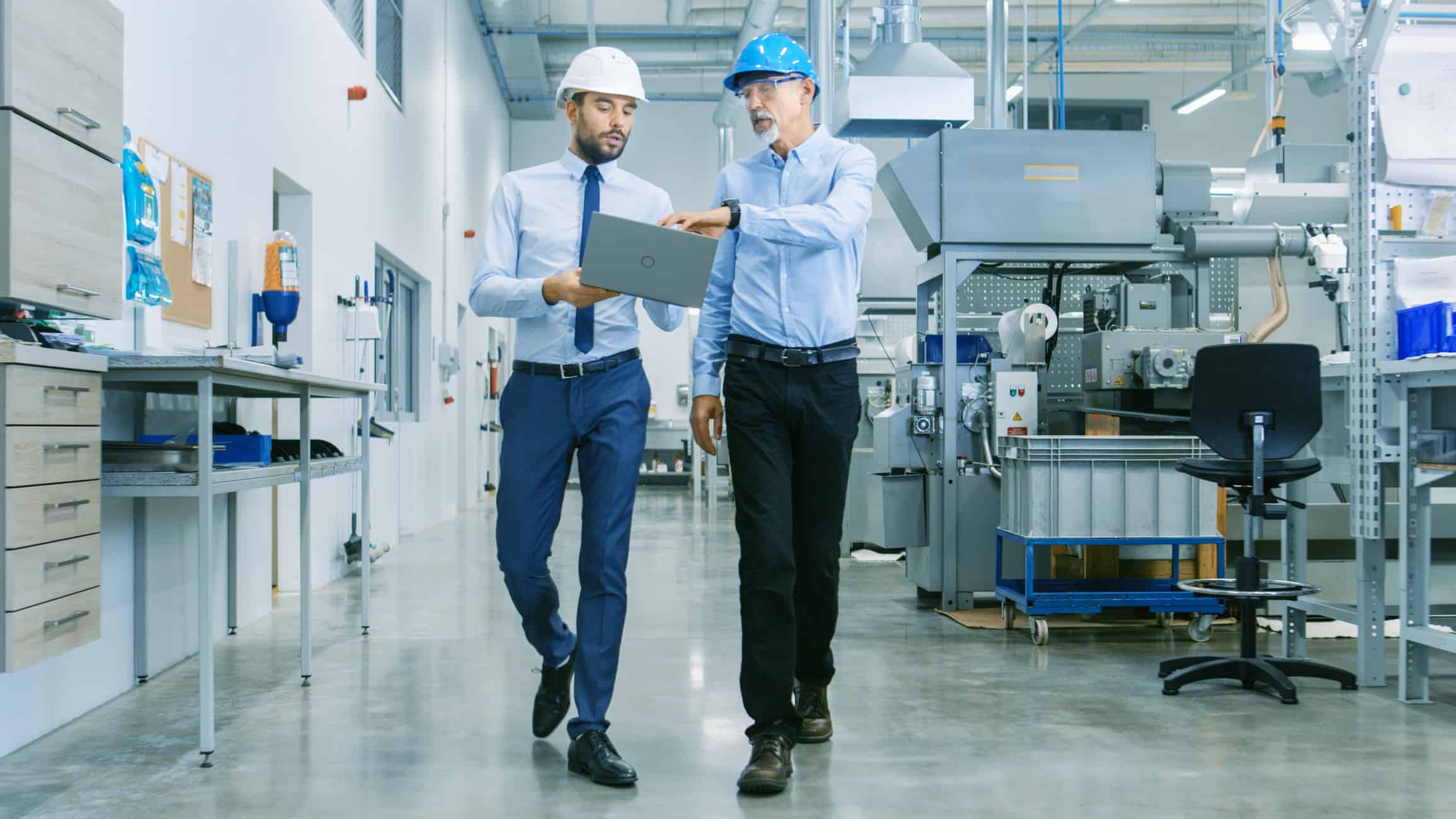 Engineers walk through a facility.